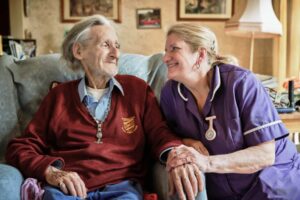 Carer and client working in care