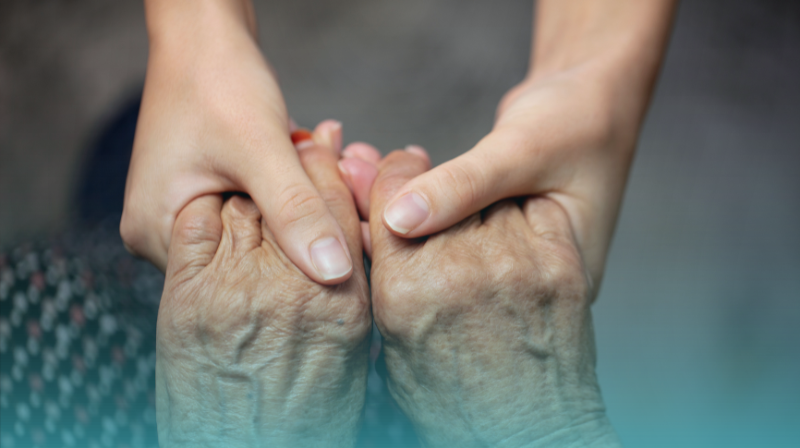 Caring For Others, Holding Hands With An Older Woman, Young Hands And Older Looking Hands.