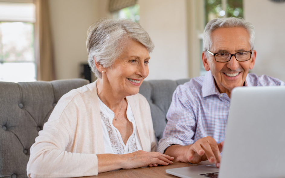 Elderly Care Options - Couple Sitting At A Laptop Researching Care Options